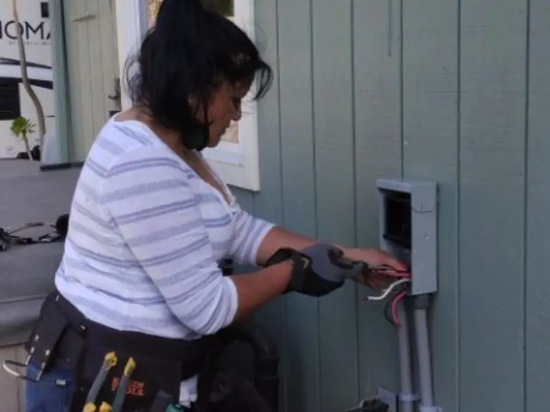 Licensed electrician wiring an exterior subpanel in Eastern Goleta Valley