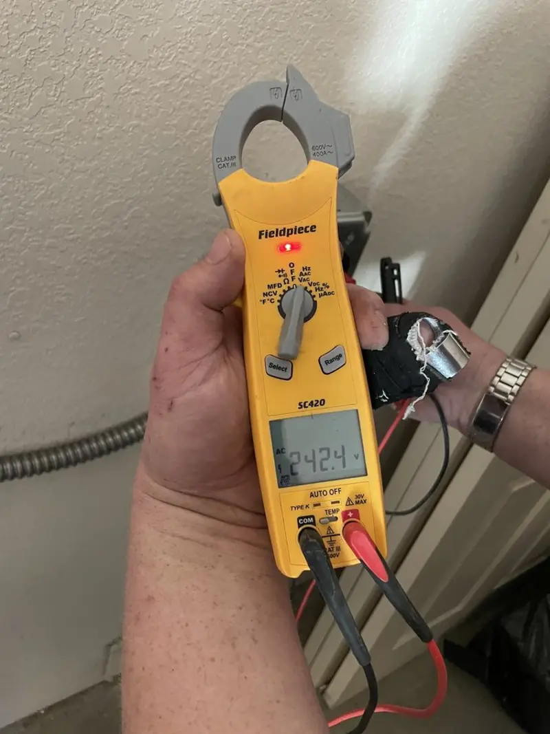 Voltage testing with clamp meter during Generator Installation in Eastern Goleta Valley